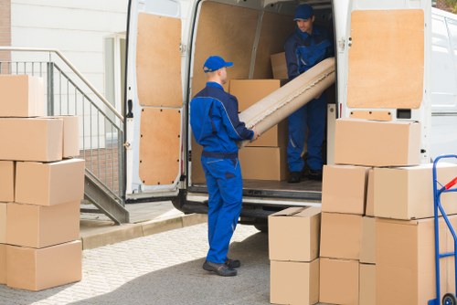 Man with a van loading furniture in Kennington street