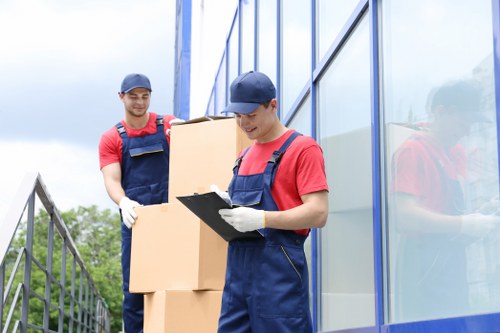 House movers working in a Kennington street with local residential properties