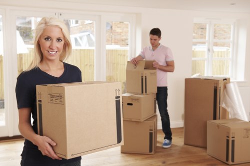 Local removal team handling boxes and furniture