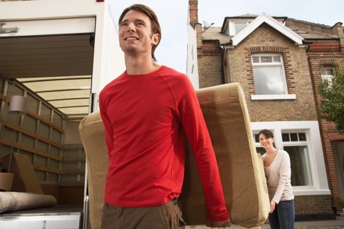Loading furniture into a truck on a local Kennington street